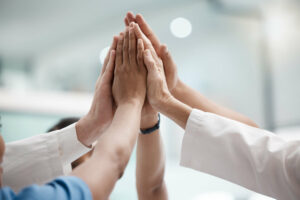 A group of Physicians high-fiving