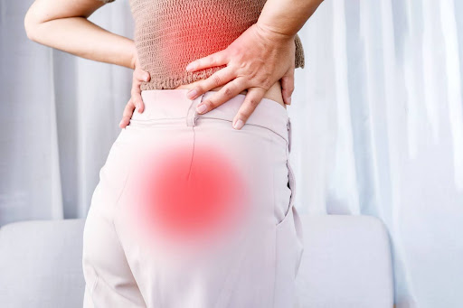 Red circles indicating radiating sciatica pain and lower back pain.