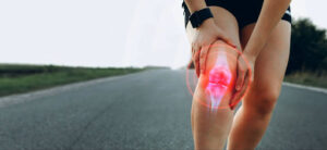 Person running with inflammation in the knee.